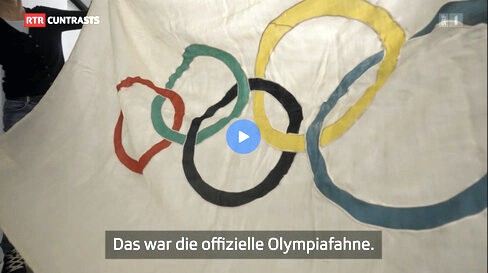 [The Olympic flag]